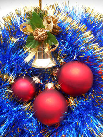 Christmas and New Year decorations red balls on a background of blue tinselの写真素材