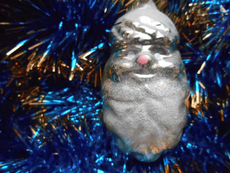 Christmas and New Year decorations on a background of blue tinselの写真素材