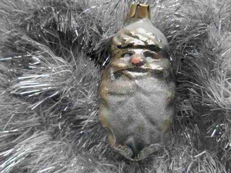 Christmas and New Year decorations on a background of silver tinselの写真素材