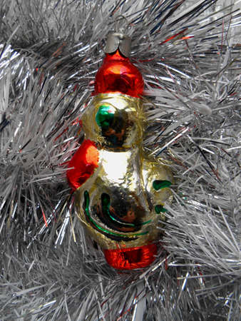 Christmas and New Year decoration on a background of silver tinselの写真素材
