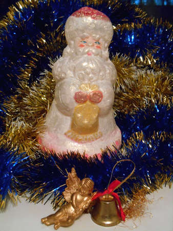 Christmas and New Year Santa Claus decoration on a background tinselの写真素材