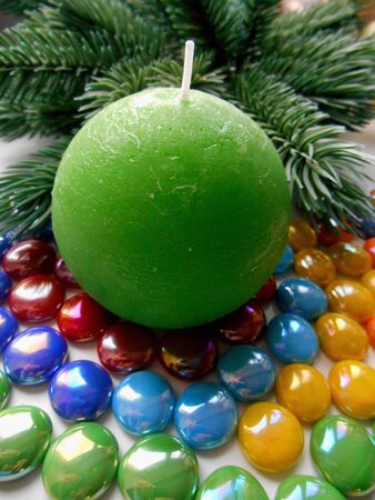 Christmas and New Year decoration-tree candle and colored stonesの写真素材