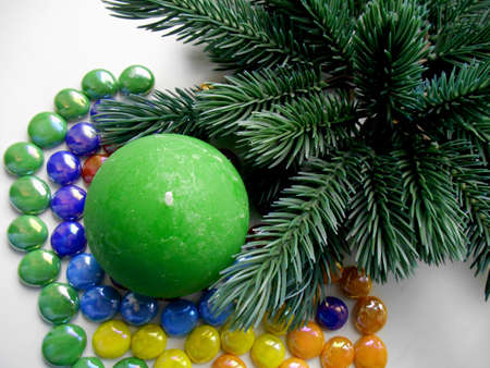 Christmas and New Year decoration-tree candle and colored stonesの写真素材