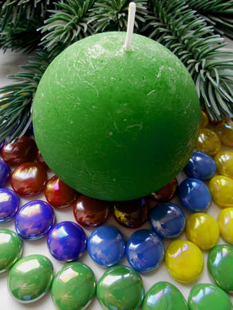 Christmas and New Year decoration-tree candle and colored stonesの写真素材