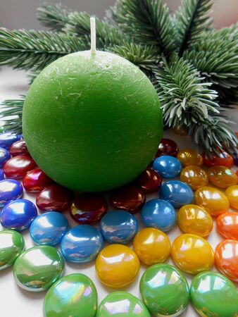 Christmas and New Year decoration-tree candle and colored stonesの写真素材