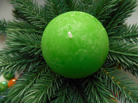 Christmas decoration firtree and green candleの写真素材