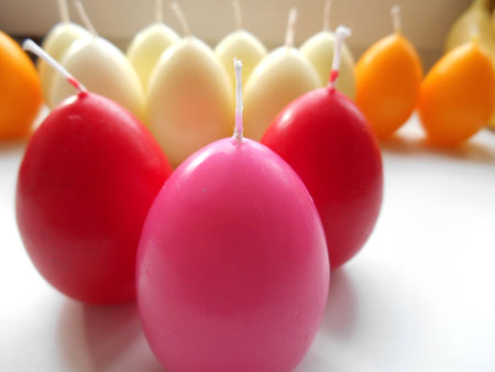  Colored egg candles on a white backgroundの写真素材