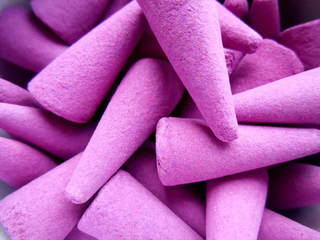 Violet incense in the form of pyramids backgroundの写真素材