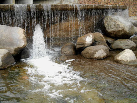 The water and stones on the waterfallの写真素材