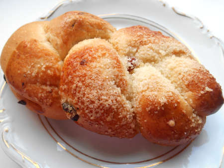 Bun on a plate on white backgroundの写真素材
