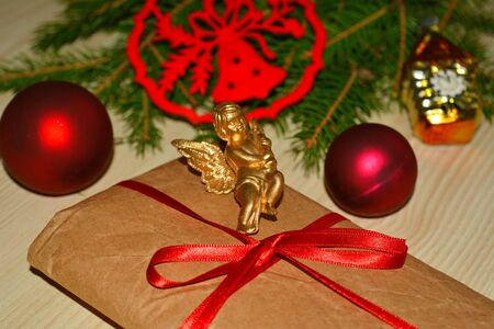 Christmas and New Year gift and red balls on a natural backgroundの素材