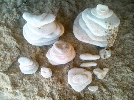 Beautiful white stones balance on a rock background