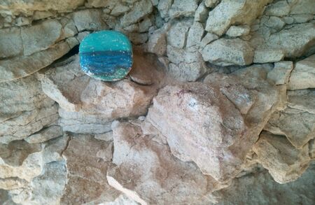 Drawing sea on the stone on a stone rock backgroundの素材