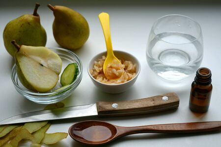 Fresh fruits pears and cucumber mask handmade ingredient on a white backgroundの素材