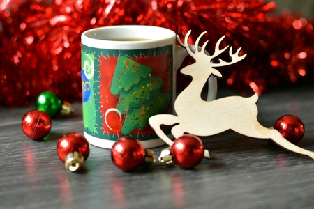 Cup of coffee and decor deer christmas timeの素材