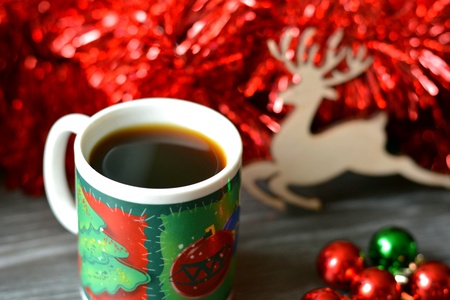 Cup of coffee and decor deer christmas timeの素材