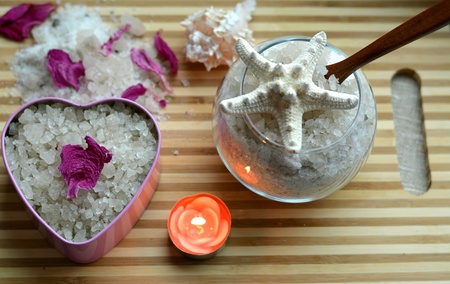 Spa sea salt bath heart and candle table backgroundの素材