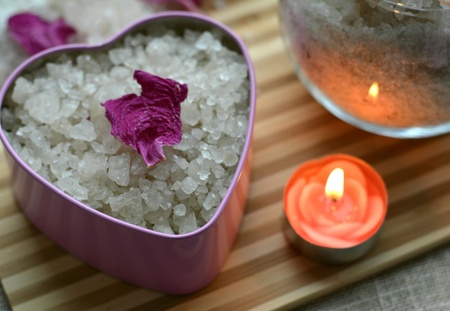 Spa sea salt bath heart and candle table backgroundの素材