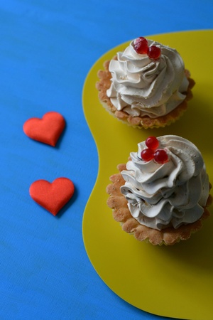 Two cakes and red hearts blue backgroundの素材