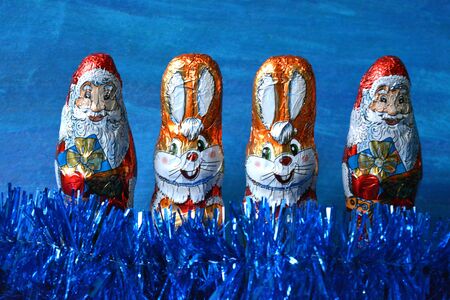 Christmas and  New Year rabbits and Santa Claus sweets blue backgroundの素材