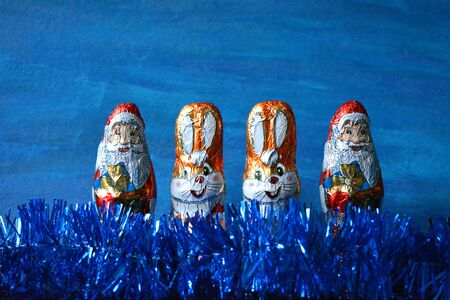 Christmas and  New Year rabbits and Santa Claus sweets blue backgroundの素材