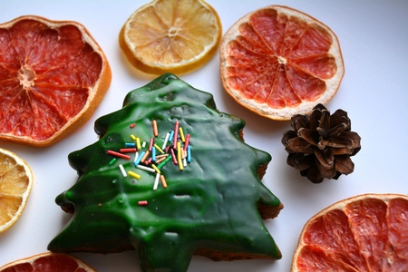Christmas and New year gingerbread and dry sliced fruits on a white backgroundの素材