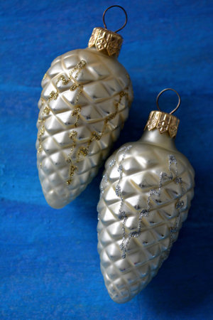 Christmas and New year decorations cones on a blue backgroundの素材