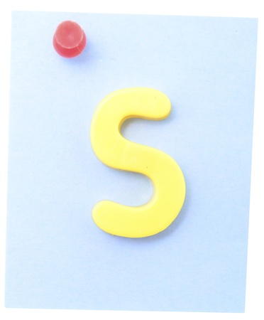 note with letter on clerical pin isolated on whiteの写真素材