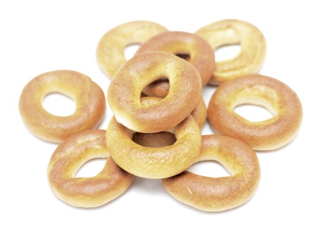 several dry bagels isolated on white background