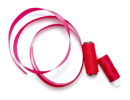 thread with ribbon isolated on white background