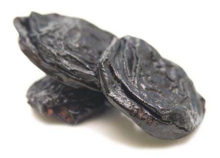 prunes isolated on a white の写真素材