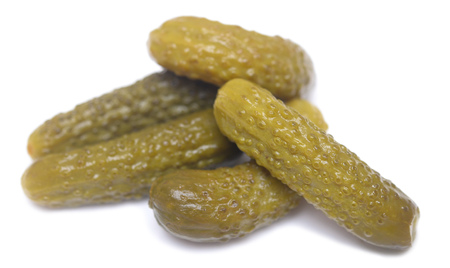 salted cucumbers isolated on white backgroundの写真素材