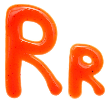 letters of ketchup isolated on whiteの写真素材