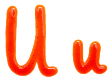 letters of ketchup isolated on whiteの写真素材