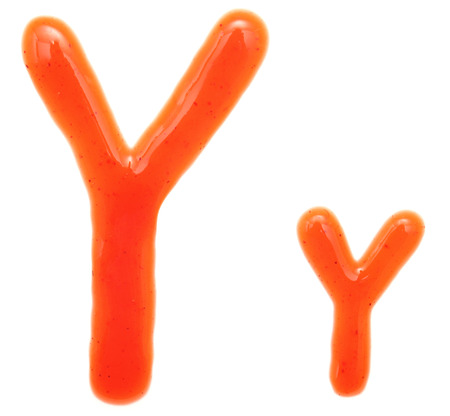 letters of ketchup isolated on whiteの写真素材