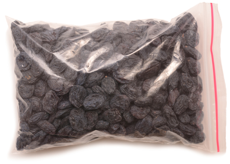 Raisin in the package isolated on a white backgroundの写真素材