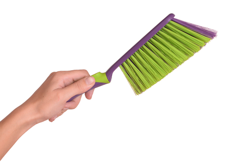 brush in female hands on a whiteの写真素材