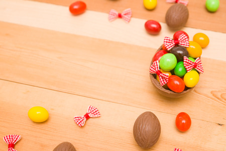 Easter chocolate eggs on a wooden backgroundの写真素材