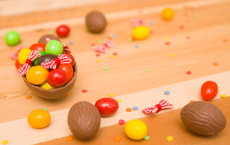 Easter chocolate eggs on a wooden backgroundの写真素材