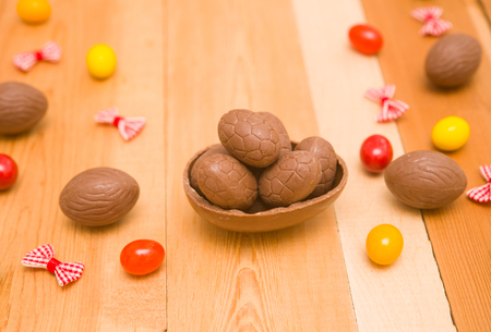 Easter chocolate eggs on a wooden backgroundの写真素材