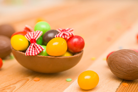 Easter chocolate eggs on a wooden backgroundの写真素材