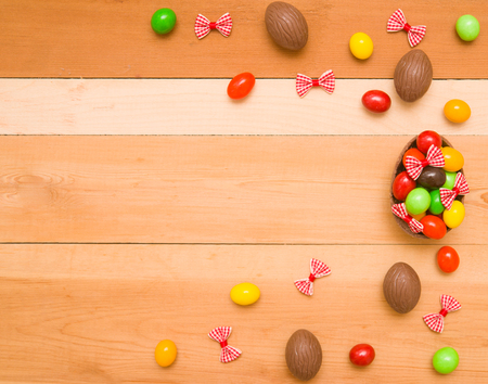 Easter chocolate eggs on a wooden backgroundの写真素材