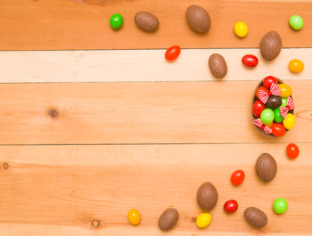 Easter chocolate eggs on a wooden backgroundの写真素材