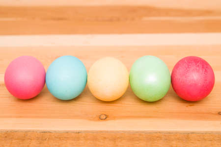 Easter eggs on a wooden backgroundの写真素材