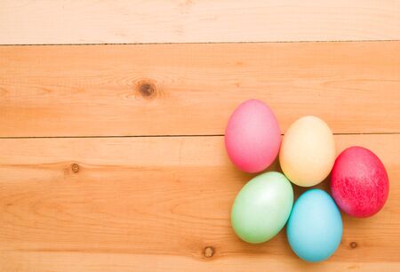 Easter eggs on a wooden backgroundの写真素材
