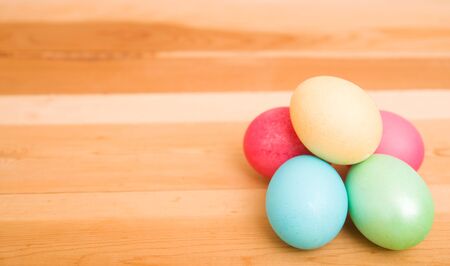 Easter eggs on a wooden backgroundの写真素材