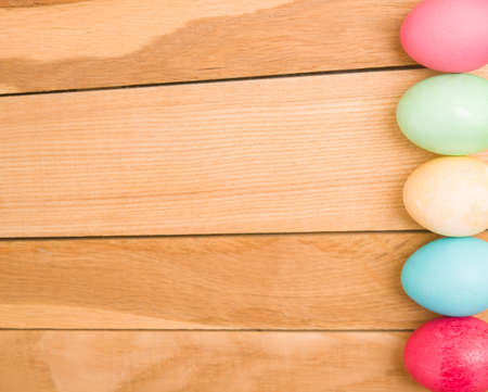 Easter eggs on a wooden backgroundの写真素材
