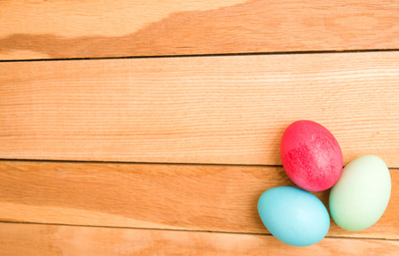 Easter eggs on a wooden backgroundの写真素材