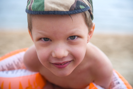 Happy child on the beach closeupの写真素材