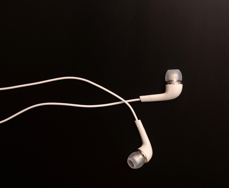 White headphones on black backgroundの写真素材